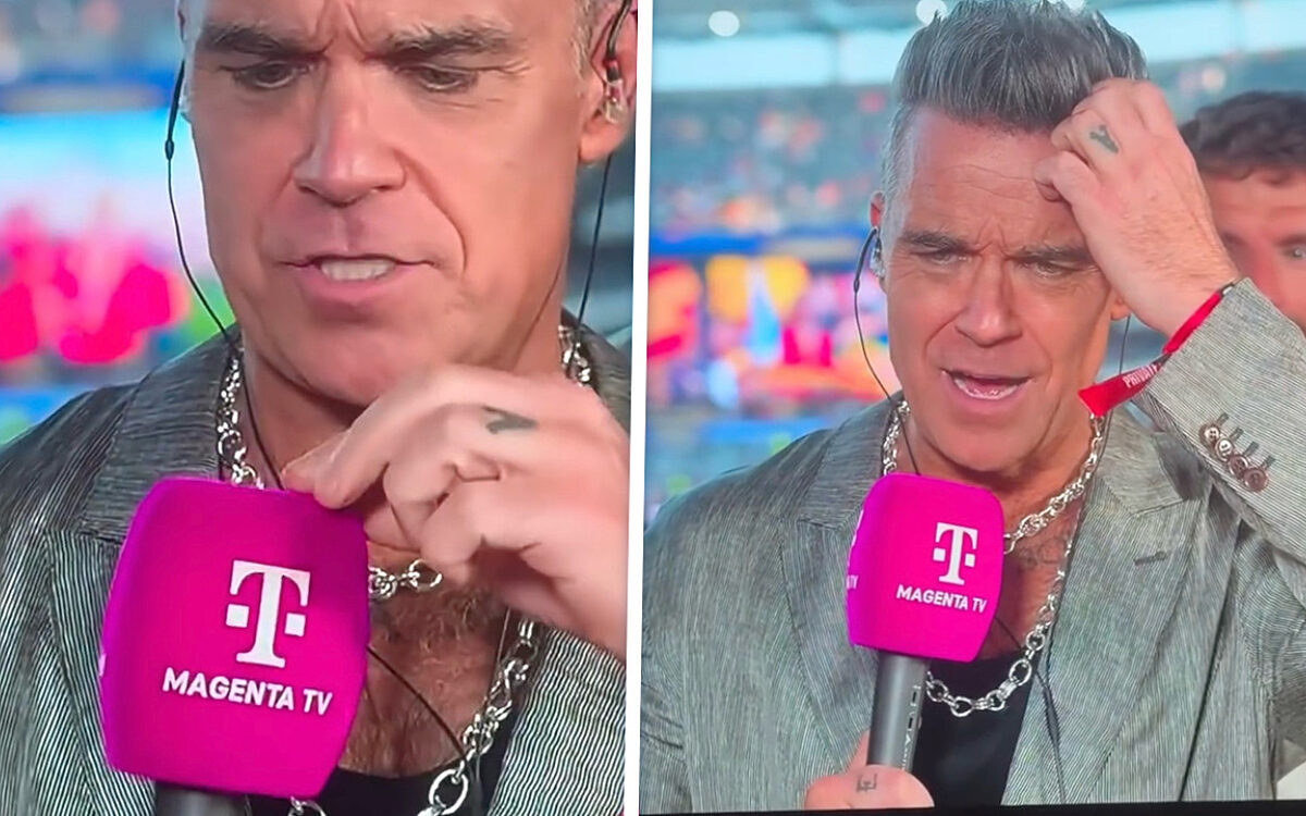 Oeps! Robbie Williams verliest 'wit brokje' live op Duitse tv tijdens WK-finale